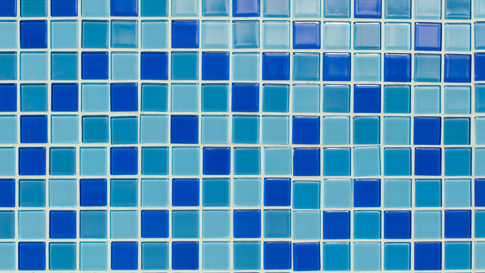 Blue and light blue glass mosaic tiles in geometric pattern